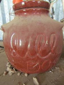 lot 684 image: brown canister with match books, planter