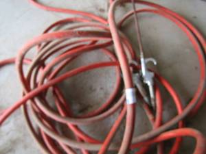 lot 722 image: 2 orange air hoses with hook up on them
