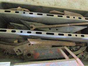 lot 779 image: Tote full of various tractor pieces