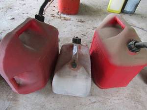 lot 792 image: 3 various size red gas cans