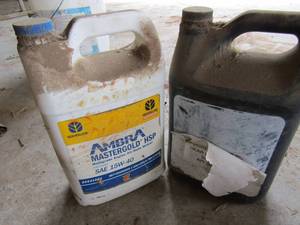 lot 795 image: 2 used containers of tractor oil