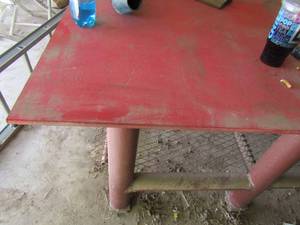 lot 797 image: WELDING TABLE -  solid red steel work shop table great condition 38 X 72 X48