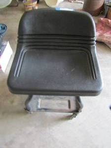 lot 404 image: Black rolling workshop stool with bottom storage area