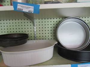 lot 414 image: white baking dish, various cake pans