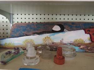 lot 451 image: piece of wood with painted duck, painted hand saw, plate holder, various cork screws