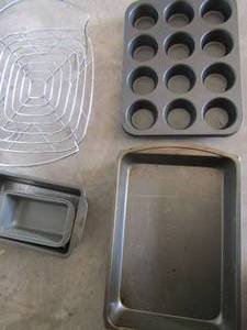 lot 460 image: 12 cup muffin pan, bread pans, casserole dish stand, metal casserole dish