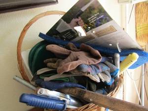 lot 499 image: wicker basket with various tools, gloves, sprayers, and more