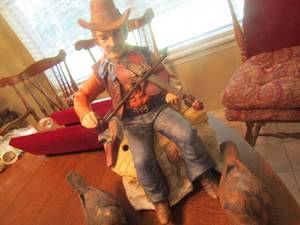 lot 307 image: hand made and hand painted porcelain melody in motion cowboy sitting of his saddle playing the violin modeled by seigi nakane, 2 ceramic birds
