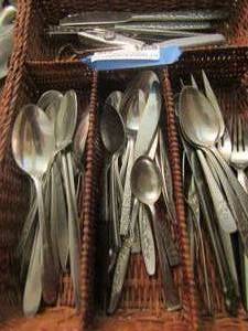 lot 320 image: wicker silverware tray with eating utensils, knives, can opener