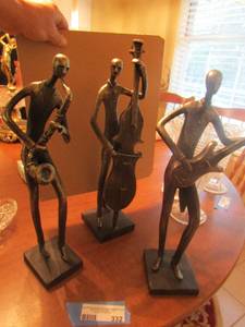 lot 332 image: 14 in tall guitar musician, 15 12 in tall cello musician, 14 in tall sax musician