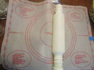 lot 336 image: white rolling pin and a pastry doe matt with recipes