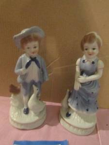 lot 351 image: made in Korea boy and girl 6 inches tall feeding the ducks boy is missing hands