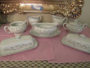 lot 359 image: Sheffield fine China classic 501 serving pieces includes 2 creamers, 2 sugar bowls 1 is missing lid, salt and pepper shakers, gravy boat with tray attached, 2 butter dishes with covers   X$$