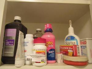 lot 63 image: medicine lot includes pepto, Tylenol, Miramax, peroxide, baby powder and more