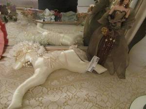 lot 138 image: clothed stuffed unicorn, doll on metal stand