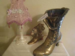 lot 119 image: metal boot with 2 ceramic boots 12 in tall white and pink lamp