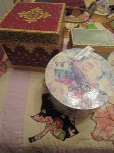 lot 255 image: double handled wicker basket with metal sun and moon dcor, other covered boxes