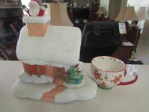 lot 173 image: sleigh bell ginger bread man coffee cup, plug in light house with Santa coming out chimney
