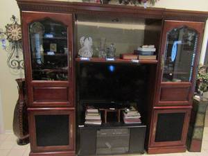 lot 24 image: 4 piece cherry wood living room entertainment center HKR furniture size - 77x 7ft 34 x 22 has 2 glass doors and 2 bottom door with blacked out screen CONTENTS NOT INCLUDED