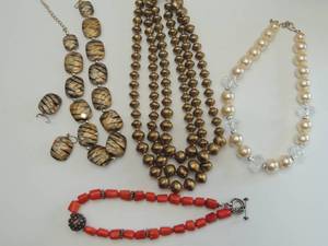lot 527 image: 4 necklaces- red, pearl, gold, gold tiger stripe with pierced earrings