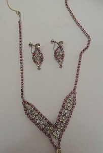 lot 585 image: Pink and clear diamond like earrings and necklace. Stunning vintage