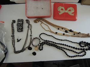 lot 598 image: 2 bracelets, 4 necklaces, 2 earrings that match necklaces in Lucite box
