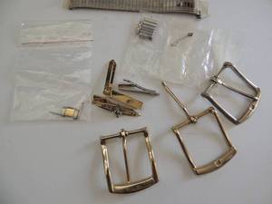 lot 580 image: tie clips, watch bands, buckles