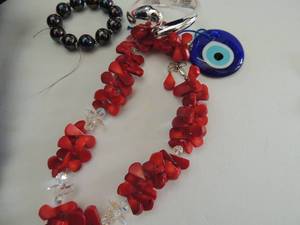 lot 589 image: silver hinge bracelet, iridescent black bracelet, bearded necklace and evil eye charm