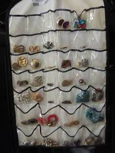 lot 599 image: hanging jewelry storage with assorted jewelry