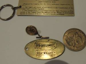 lot 573 image: metal key chains, TABC pin