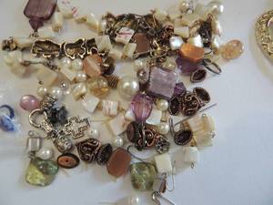 lot 512 image: pierced earring holder, broken necklace and many pair pierced earrings