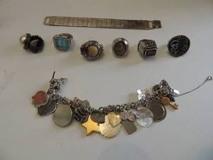 lot 555 image: 6 rings and watch band  ( 1 IS POSSIBLT JAMES AVERY) and fully 1 added charm bracelet W SOME STERLING SILVER CHARMS