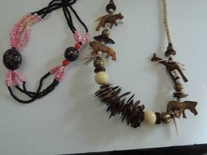 lot 545 image: wooden animal necklace and pucka shell and seed pearl necklace