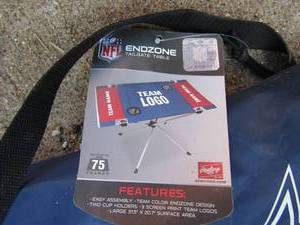 lot 33 image: Dallas cowboys tailgate table New, folds for easy storage