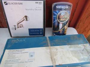 lot 43 image: Glacier Bay 886-323 pull out Laundry faucet NIB, Waterpik shower head NIB, Pegasus city loft bath faucet NIB qty 3