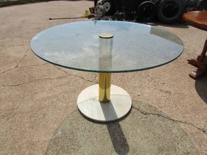 lot 57 image: 4ft oval glass table with marble bass and brass center column  30 HT