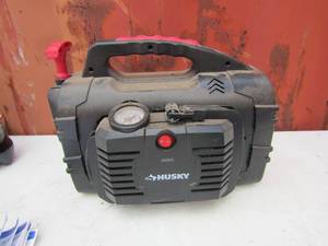 lot 64 image: Husky portable air compressor and battery charger, appears to be new
