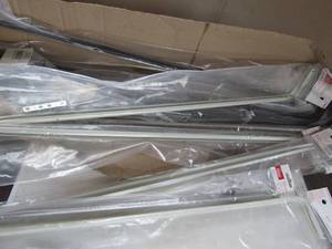 lot 121 image: Box of new curtain rods, white and black, new never opened qty 15