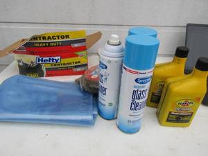 lot 208 image: 2 cycle engine oil, 38 air hose new, plastic storage bags and trash bags