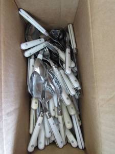 lot 232 image: box full of white stainless steal sliver ware spoonsforksknives