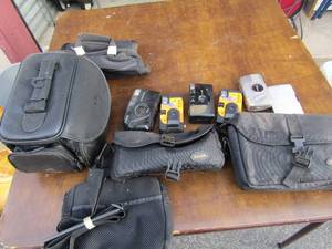lot 326 image: Lot of camera bags, plus various disposable cameras by Kodak, plus 2 camera batteries unknown working condition on each