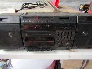 lot 378 image: GE-- am FM cassette radio with built in speakers unknown working condition- small tote bag full of various country and western tapes