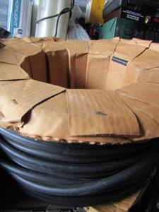 lot 383 image: Roll of black hose tubing