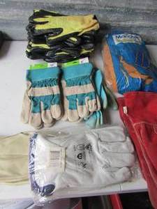lot 25 image: Industrial work gloves, some are rubber, west Chester, leather work gloves qty 6 single and 2 bags all new