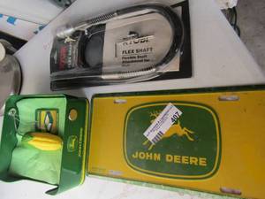 lot 407 image: Ryobi flexible shaft NIP, john deer license plate and napkin holder with corn handle new
