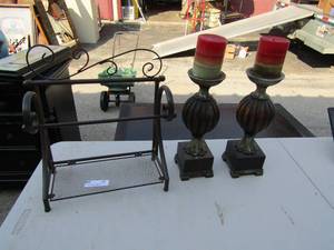 lot 12 image: Metal paper towel holder , 2 candle stands with candles 14  tall