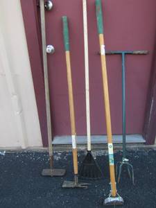 lot 70 image: yard rakes, hoes, hand tiller, and more