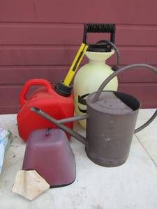 lot 83 image: 1 gallon gas can, Round up yard weeder,  tin water can, and more