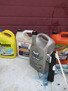 lot 84 image: used preston coolant, wood protecter, weed round up