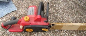 lot 110 image: Homelite electric chainsaw used a few times still like new, starts right up